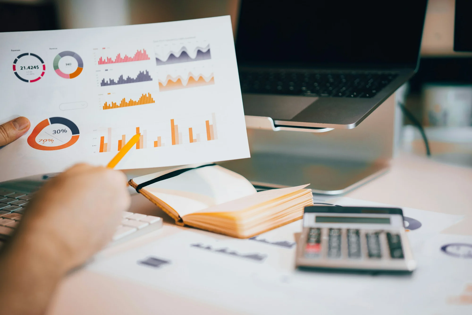 Executive analyzing performance charts and financial reports for enterprise AI value metrics
