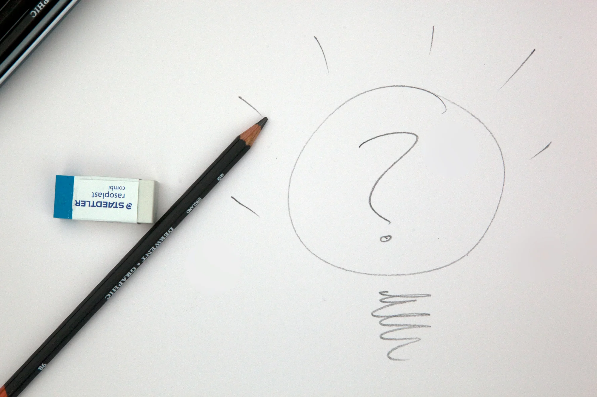 Pencil sketch of lightbulb with question mark