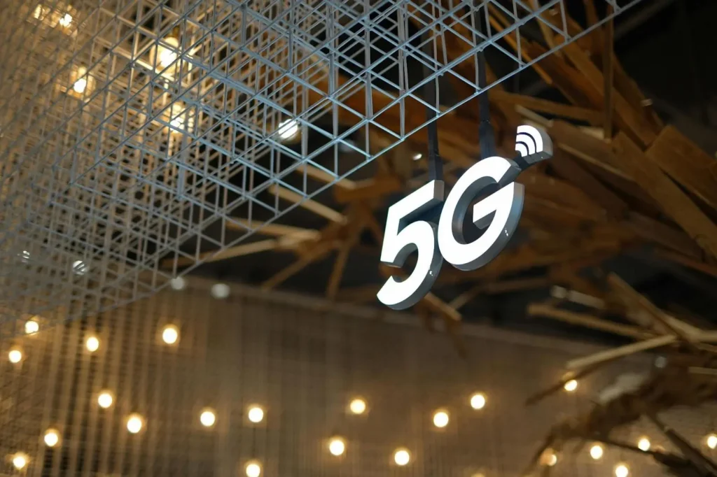 Glowing 5G sign with decorative lights