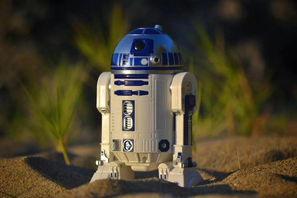 R2-D2 standing on sand