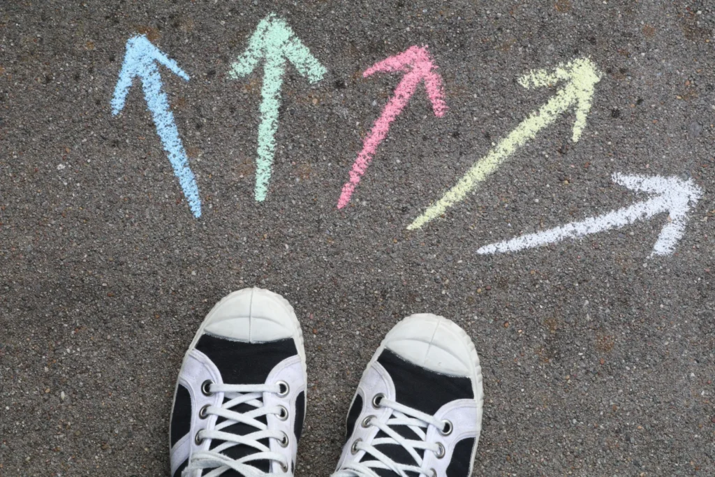 Chalk arrows on asphalt mapping a decision intelligence framework.