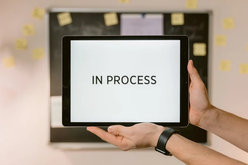 Tablet showing in process status during workflow transformation.